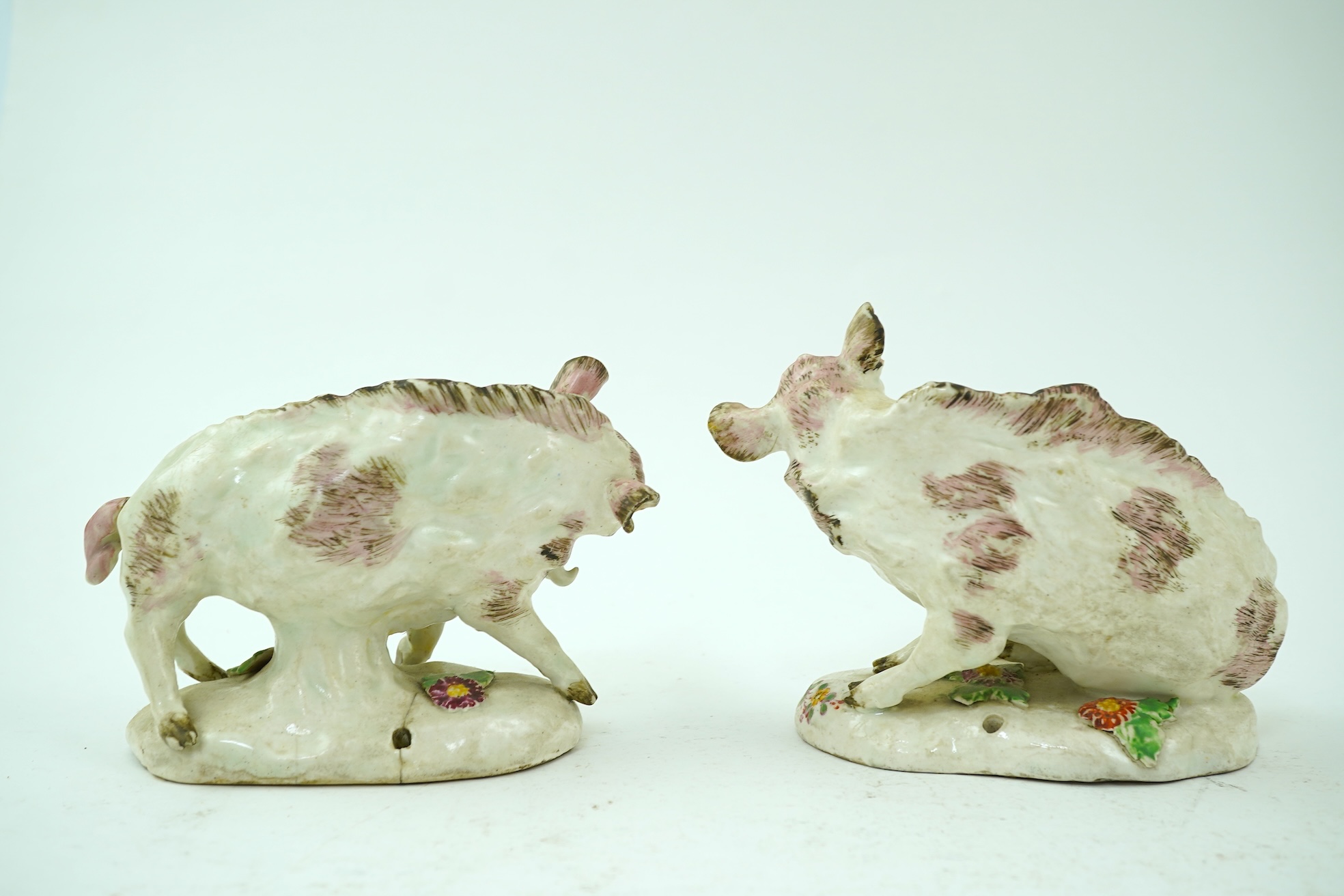 A pair of early Derby porcelain models of wild boars, c.1752-55